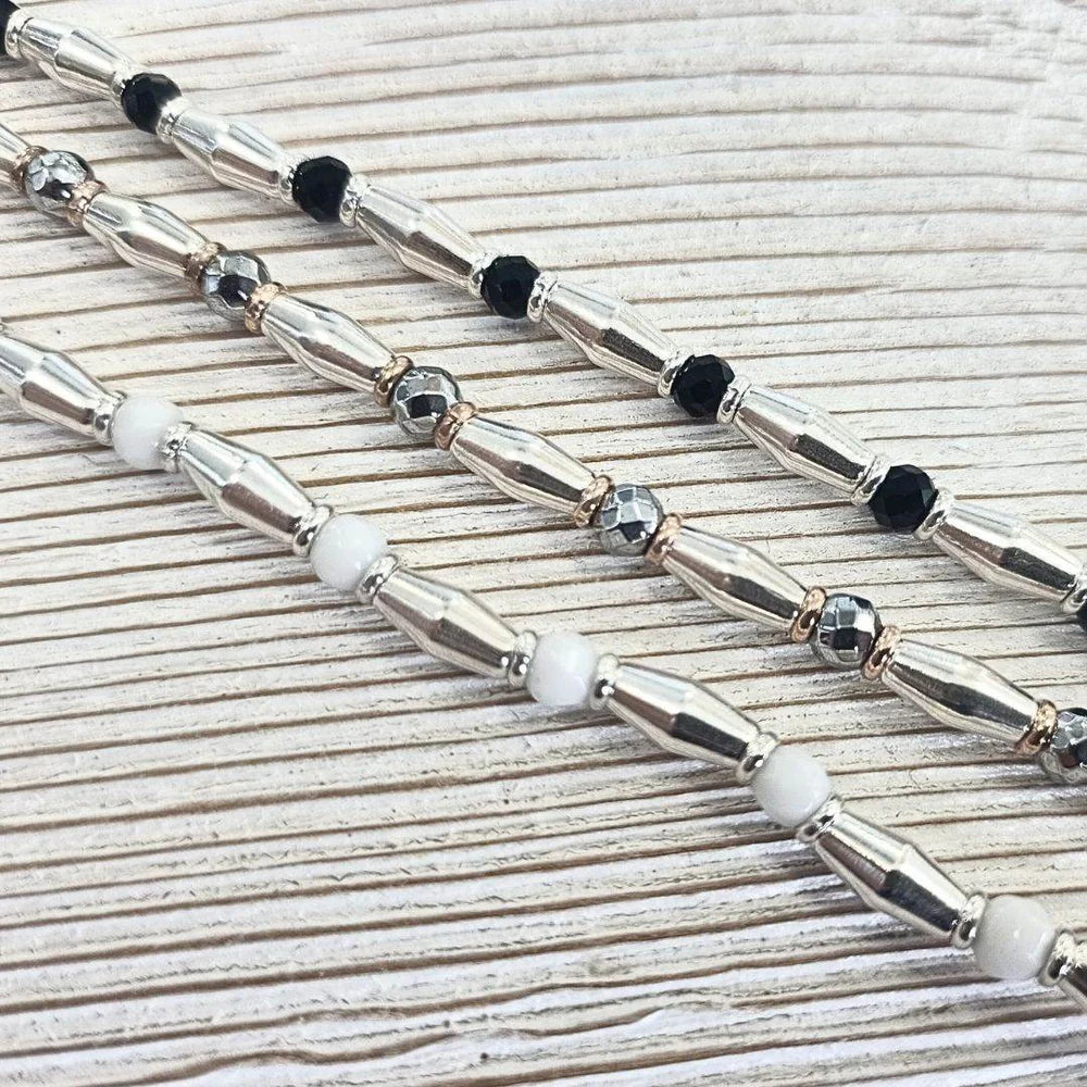 Bracciale Spadarella in argento con anelli color oro rosa e pietre nere - SPBR648