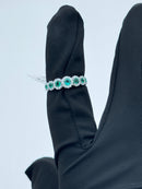 Diana - Veretta in oro bianco 18kt, giro di diamanti e 7 smeraldi - AN D. 36-7 SM