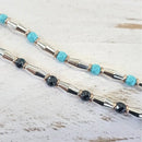 Bracciale Spadarella in argento con anelli color oro rosa e pietre nere - SPBR648
